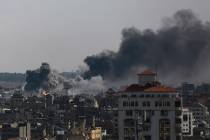 Smoke rises following Israeli airstrikes on Gaza City, Saturday, Oct. 21, 2023. (AP Photo/Abed ...