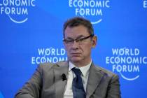File - Pfizer CEO Albert Bourla sits on a podium at the World Economic Forum in Davos, Switzerl ...