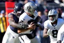 Chicago Bears defensive tackle Justin Jones (93) sacks Las Vegas Raiders quarterback Brian Hoye ...