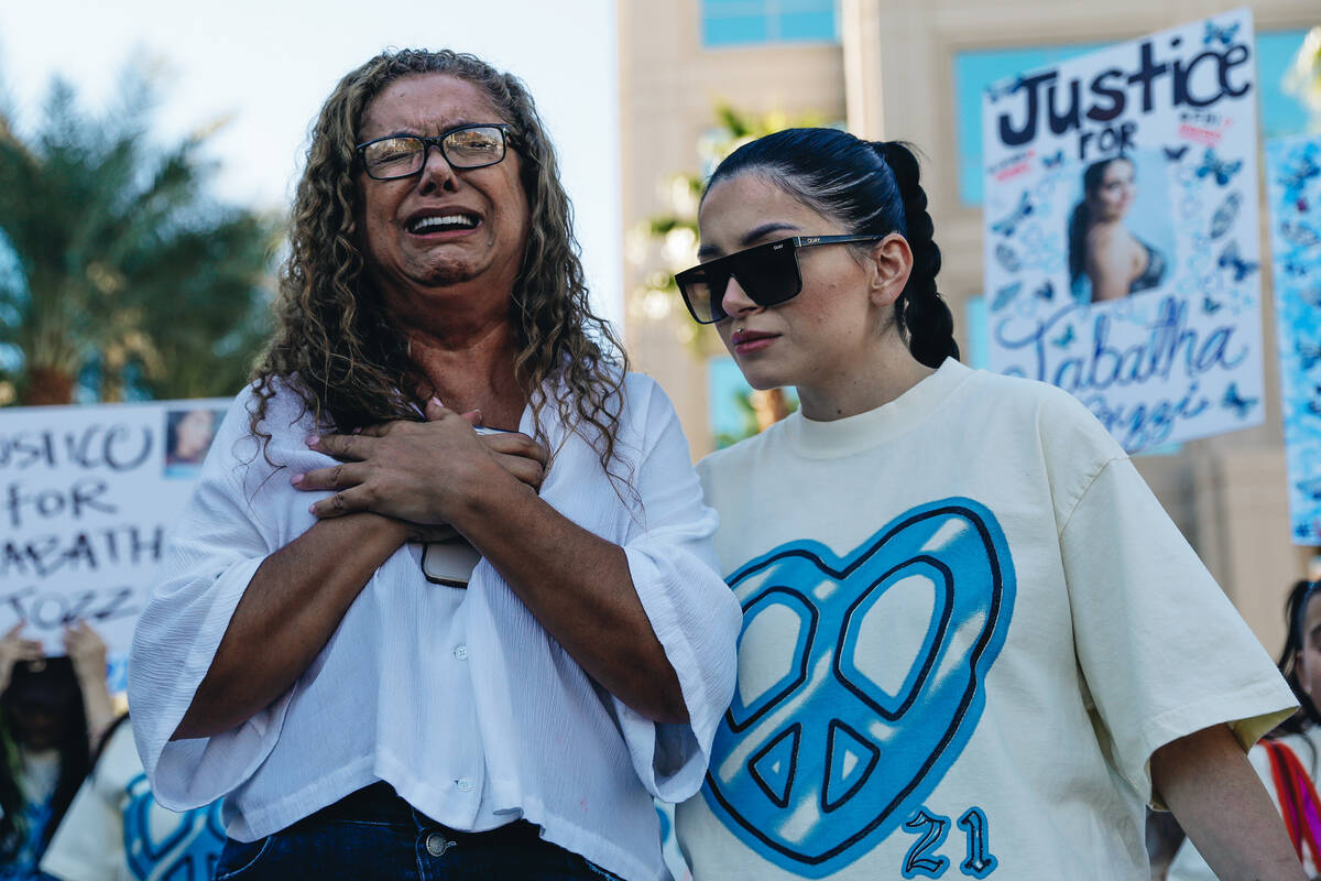 Regina Lacerda, left, cries about the killing of her daughter, Tabatha Tozzi, as Alicia Lozoya ...