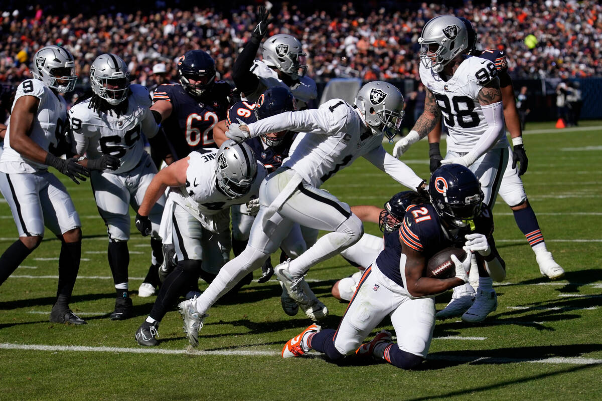 Chicago Bears running back D'Onta Foreman (21) scores his second touchdown of the game in the f ...