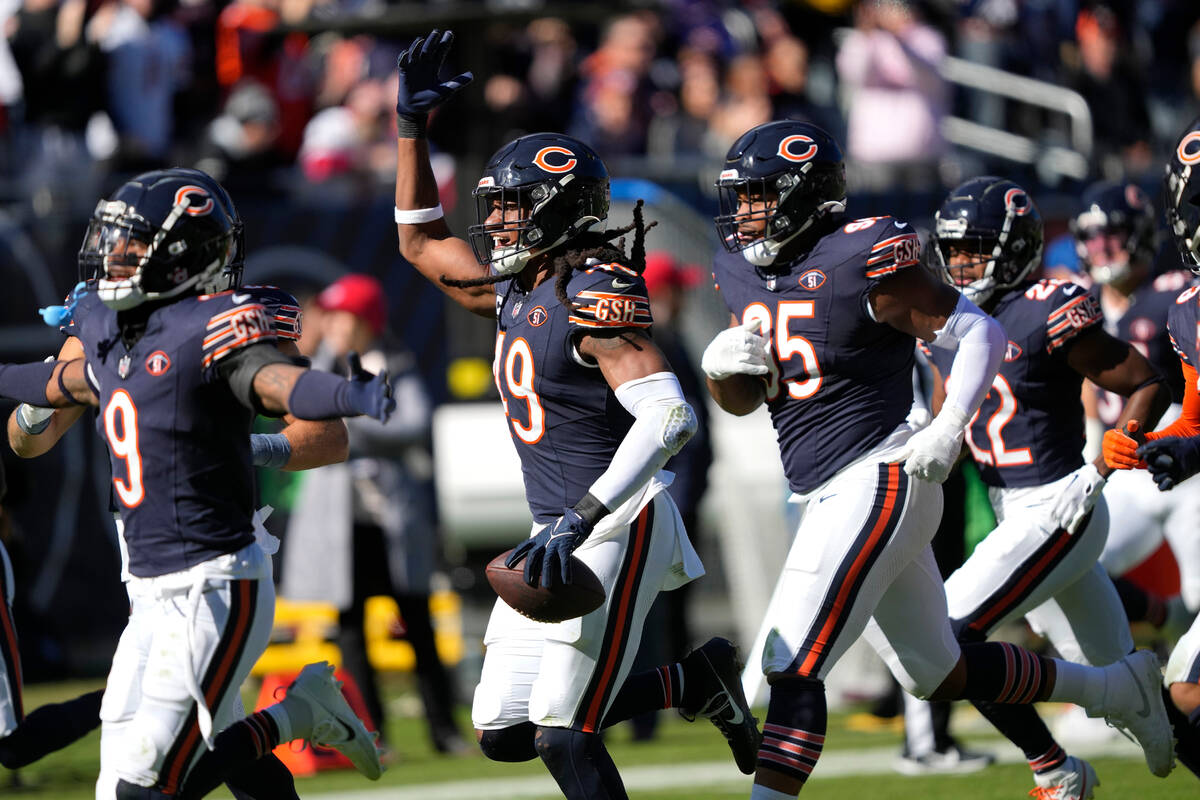 Chicago Bears linebacker Tremaine Edmunds (49) celebrates after intercepting a pass against the ...