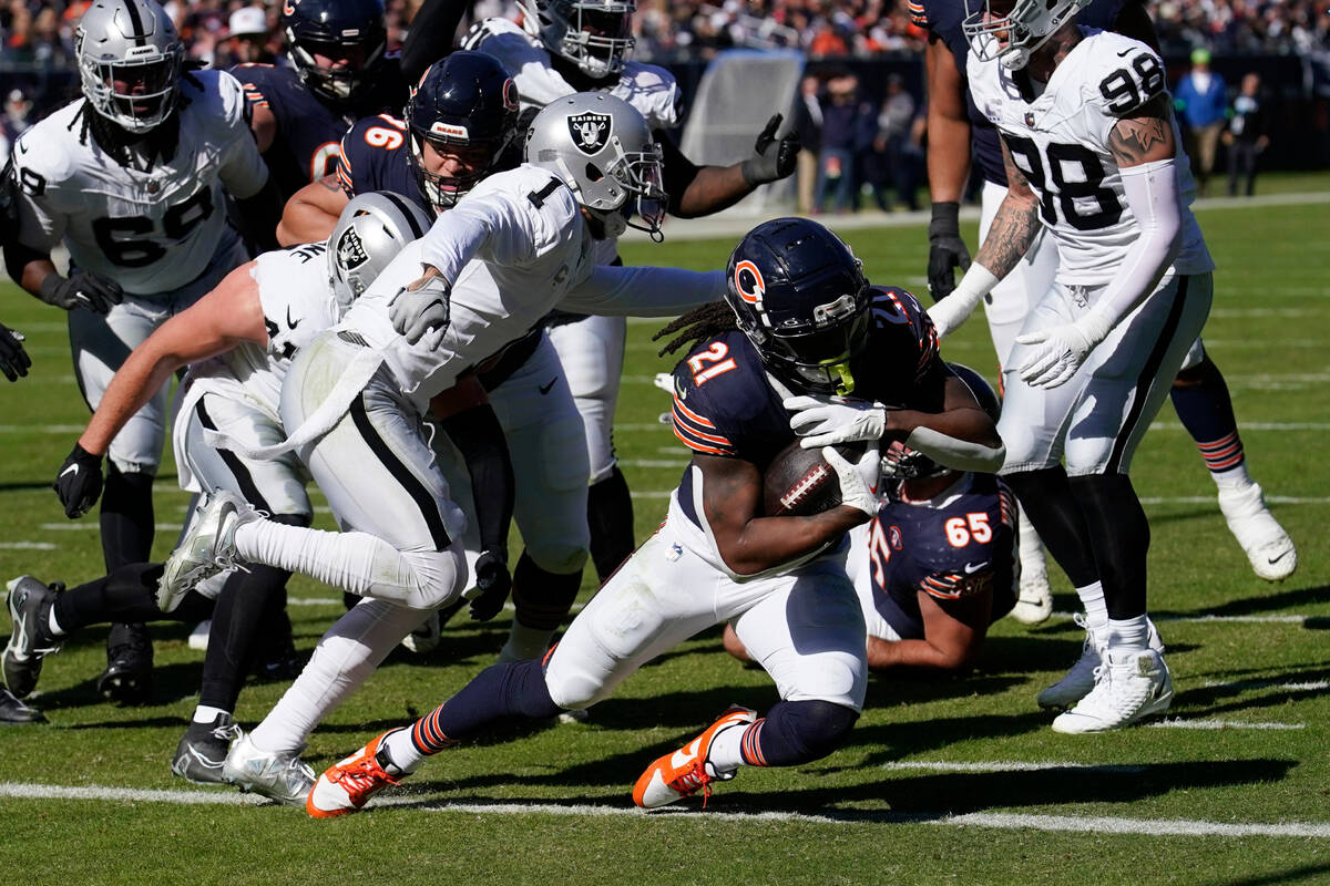 Chicago Bears running back D'Onta Foreman (21) scores a touchdown against the Las Vegas Raiders ...