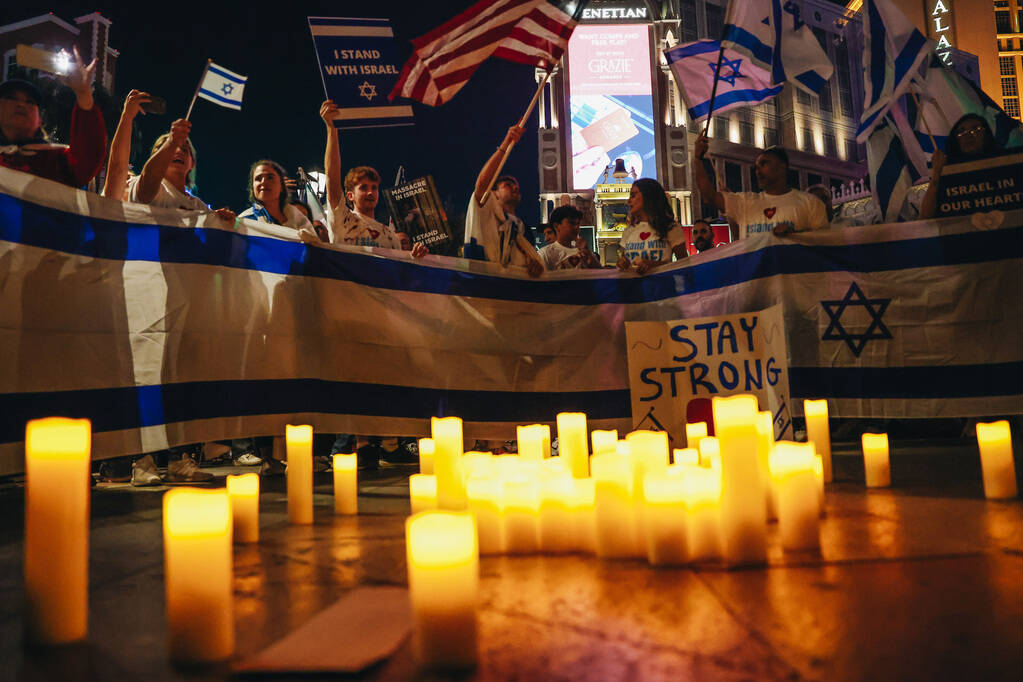 A vigil takes place during a pro-Israel rally at The Venetian on Sunday, Oct. 8, 2023, in Las V ...