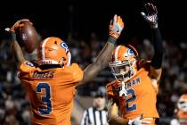 Bishop Gorman’s Devon Rice (3) and Audric Harris (2) celebrate Rice’s touchdown d ...