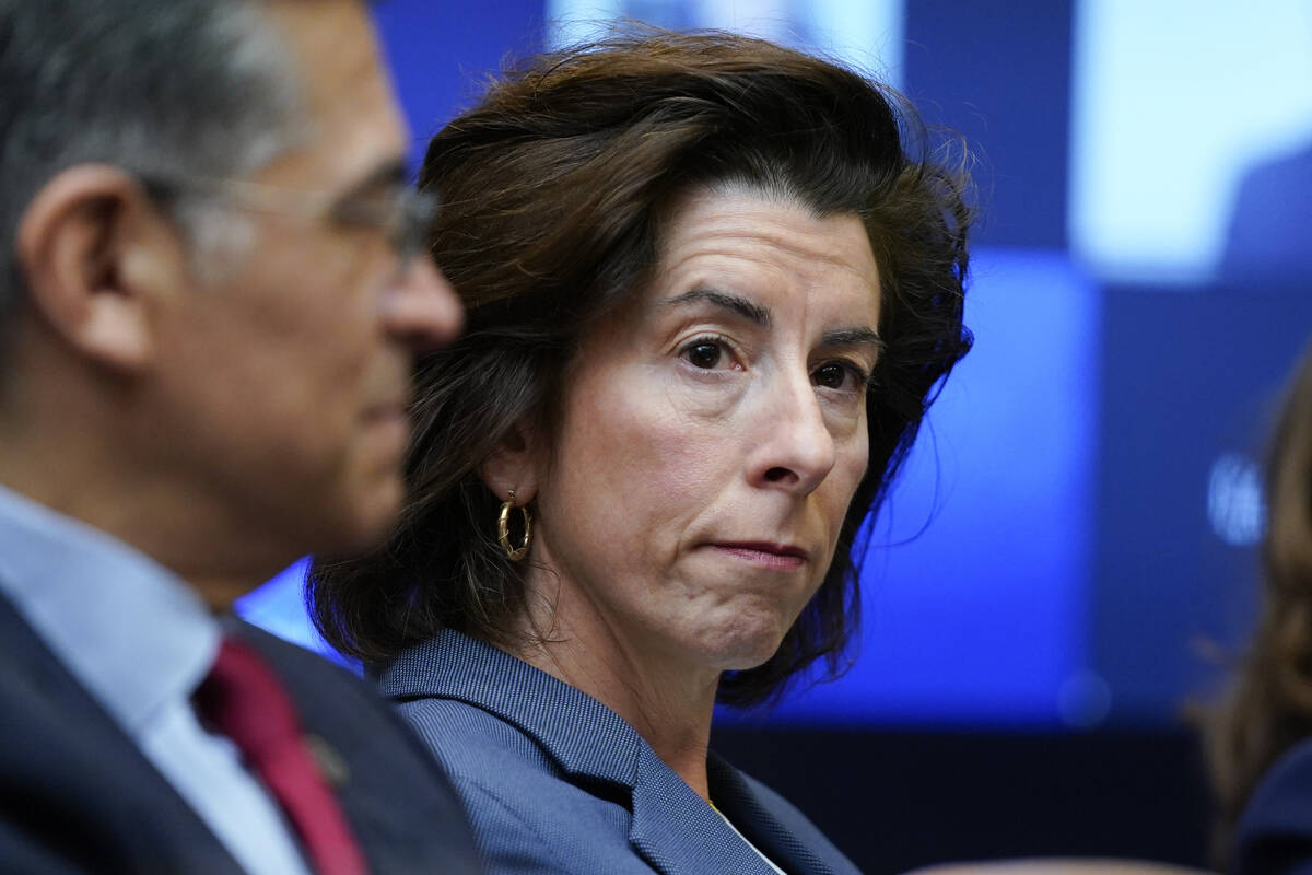 FILE - Commerce Secretary Gina Raimondo listens during a meeting with President Joe Biden's &qu ...