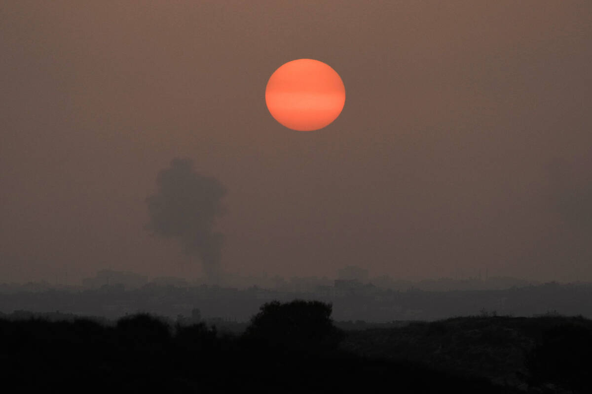 Smoke rises following an Israeli airstrike in the Gaza Strip, as seen from southern Israel, Mon ...