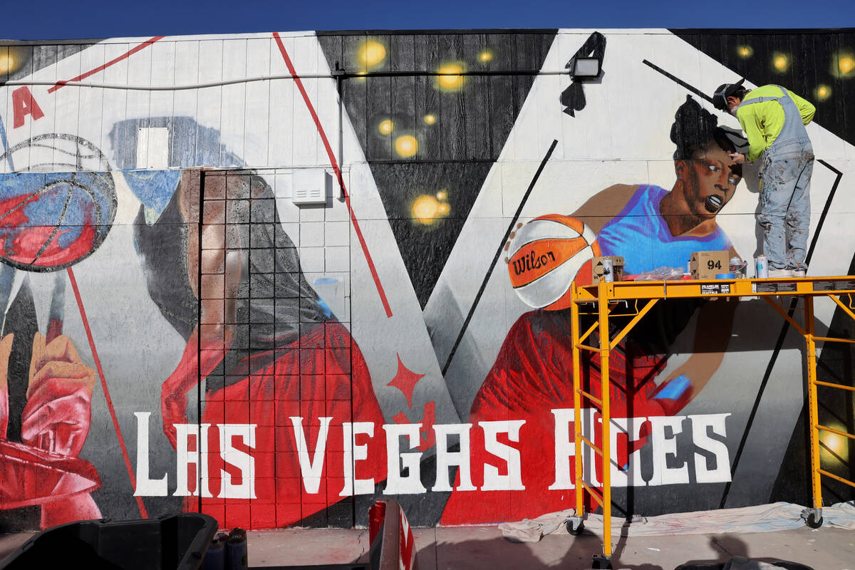 Artist Juan Ochoa paints a mural honoring the WNBA champion Aces on Main Street north of Imperi ...