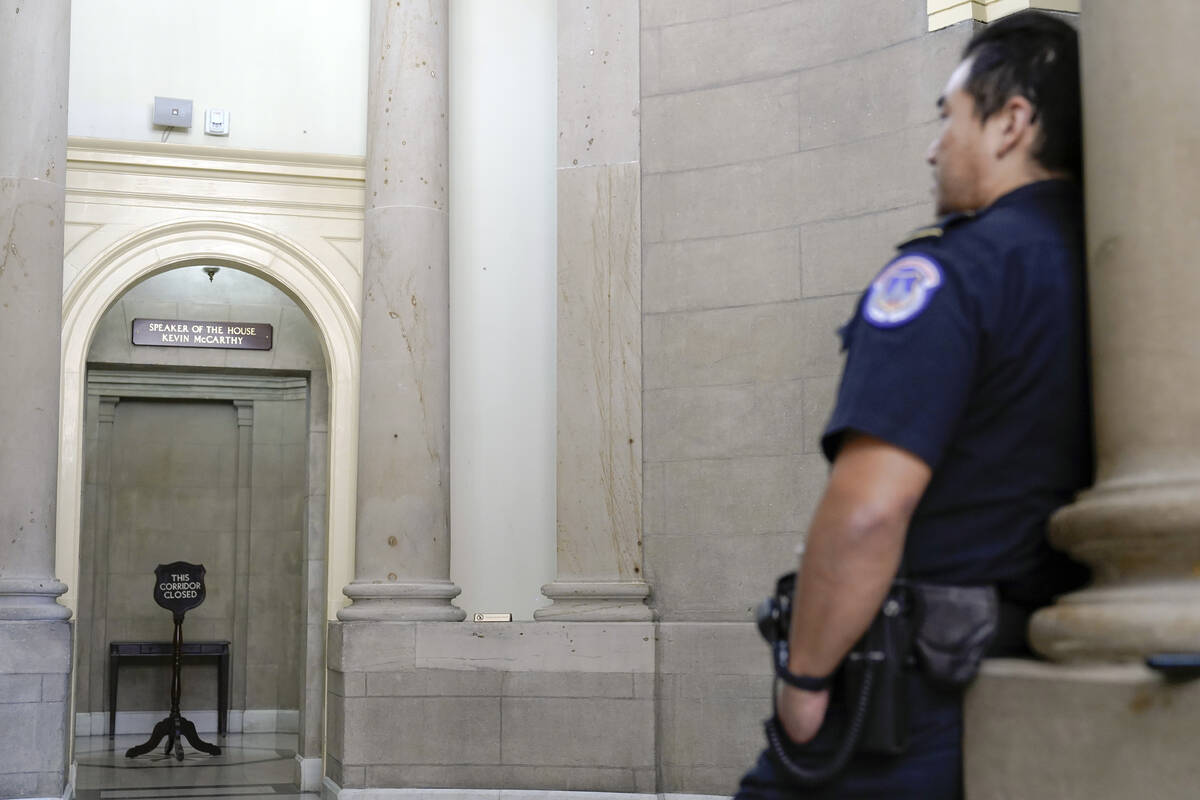 U.S. Capitol Police officer stands guard outside the office of the Speaker of the House on Capi ...