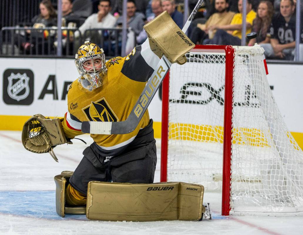 Golden Knights goaltender Logan Thompson (36) deflects away a shot from the Philadelphia Flyers ...