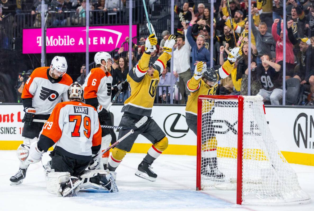 Golden Knights center Ivan Barbashev (49) and right wing Jonathan Marchessault (81) celebrate t ...