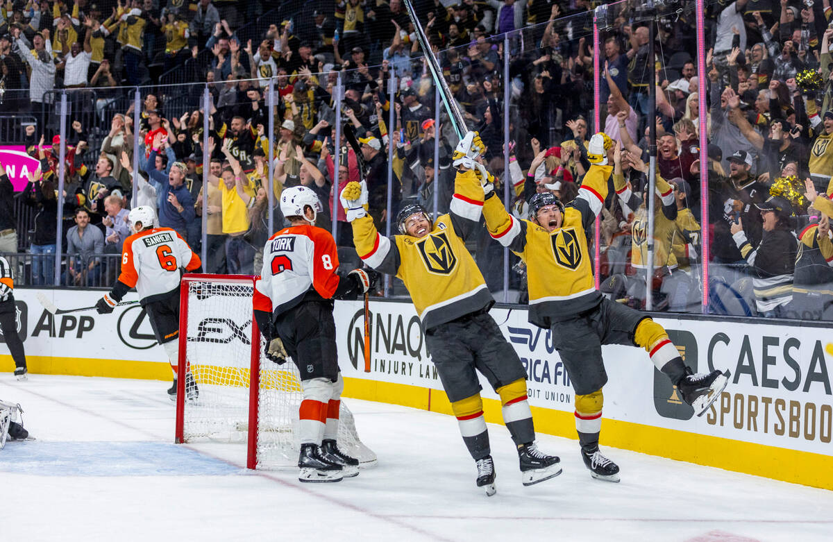 Golden Knights right wing Jonathan Marchessault (81) and center Ivan Barbashev (49) celebrate t ...