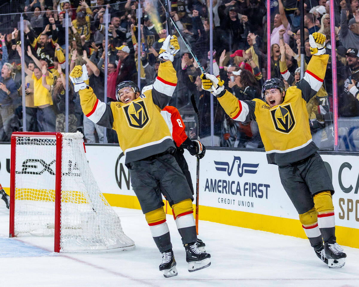 Golden Knights right wing Jonathan Marchessault (81) and center Ivan Barbashev (49) celebrate t ...