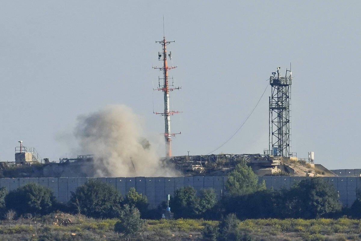 Smoke rises from inside an Israeli army position which was hit by Hezbollah fighters as seen fr ...