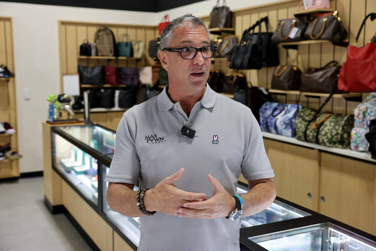 Owner Michael Mack talks about designer handbags at his Max Pawn Luxury location on South Decat ...