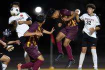 Eldorado's Henyor Archila, center right, heads the ball for an attempted goal during the second ...