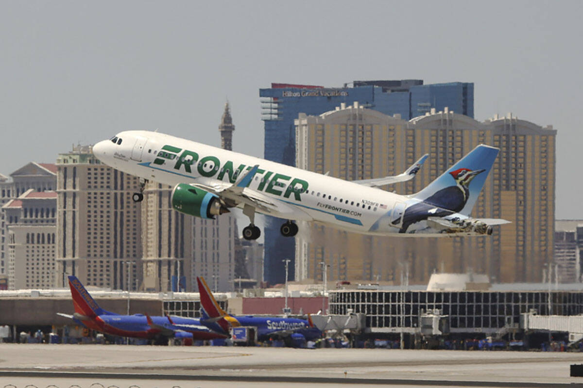 A Frontier airlines flight departs for takeoff at Harry Reid International Airport in Las Vegas ...