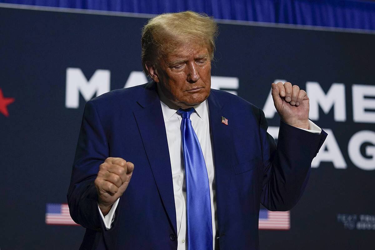 Republican presidential candidate former President Donald Trump dances after speaking at a camp ...