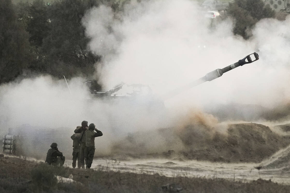 An Israeli mobile artillery unit fires a shell from southern Israel towards the Gaza Strip, in ...