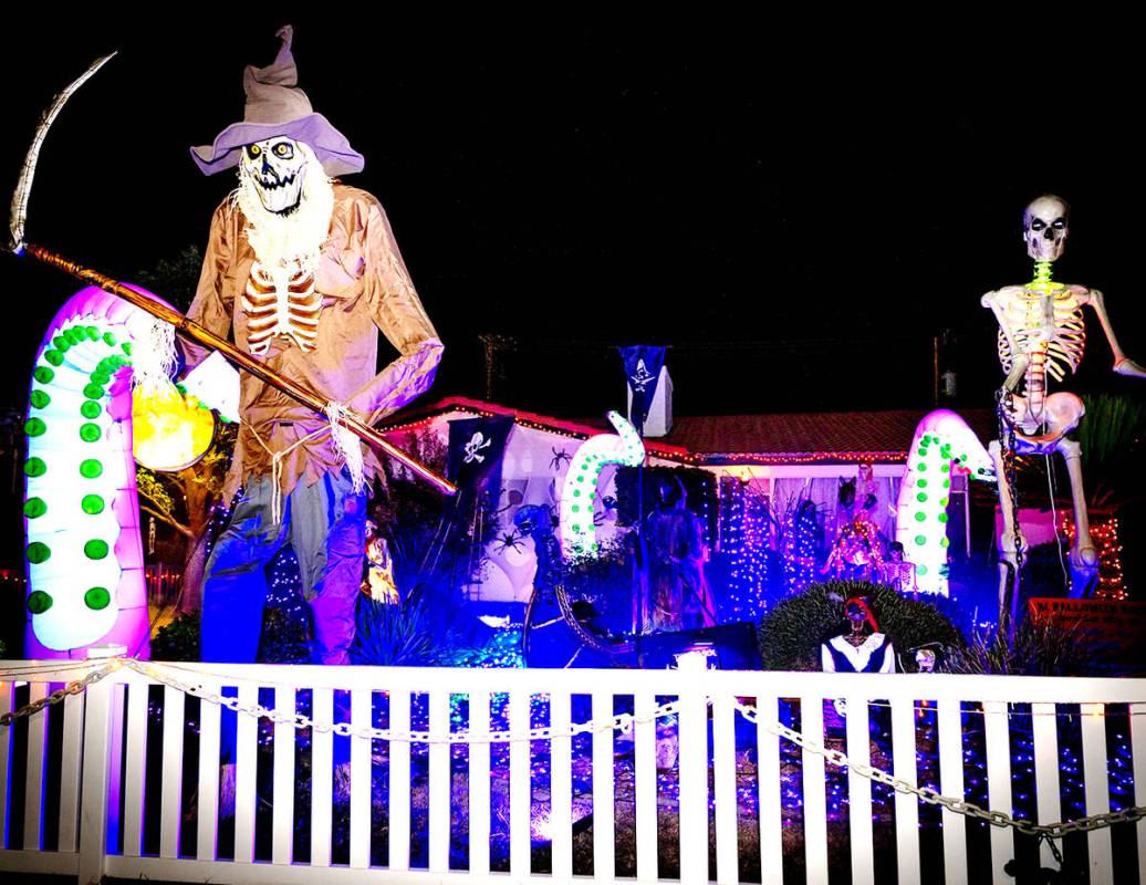 Every year, Boulder City homeowner Destry Labo transforms her front yard into the Halloween Hou ...