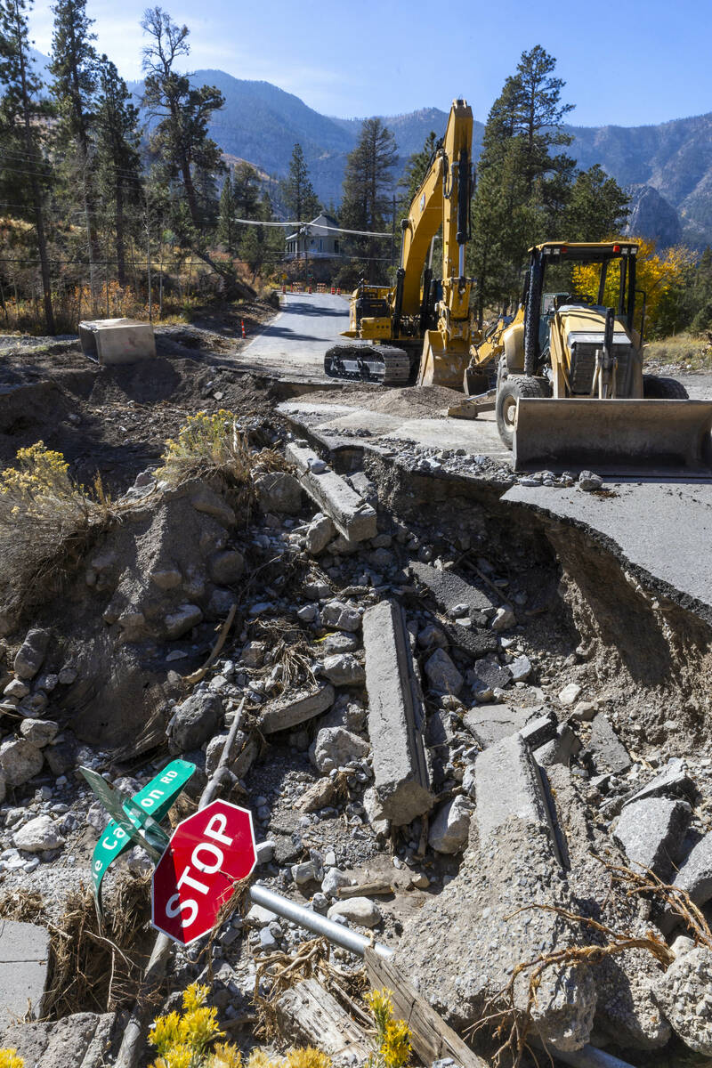 A main road into the Rainbow Canyon subdivision is still damaged and closed as repairs continue ...