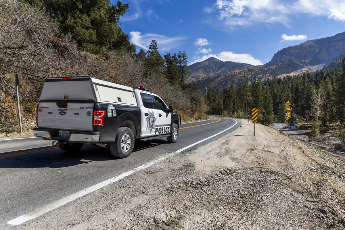 A Metro vehicle makes its way along a repaired section of Kyle Canyon Road as repairs continue ...