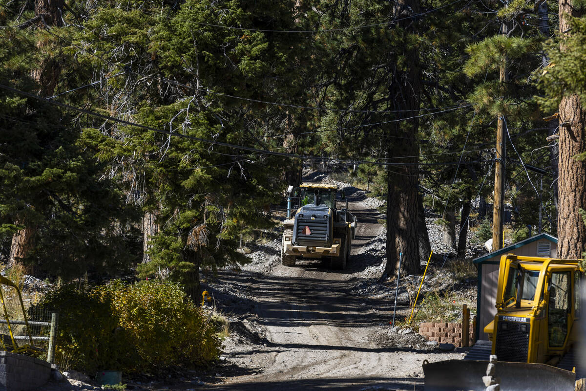 A construction vehicle makes its way up a road in Old Town as repairs continue at Mount Charles ...