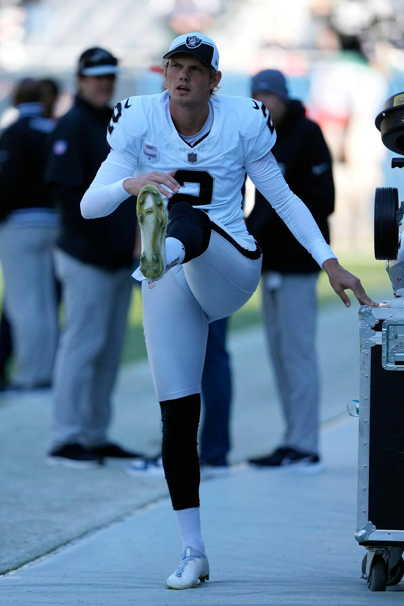 Las Vegas Raiders kicker Daniel Carlson warms up before an NFL football game against the Chicag ...