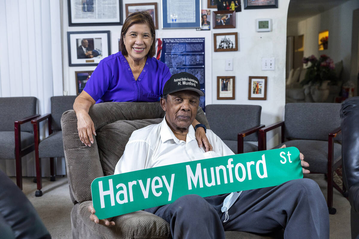 Harvey Munford relaxes at home with his wife, Vivian, while showing off a mock-up of his new s ...