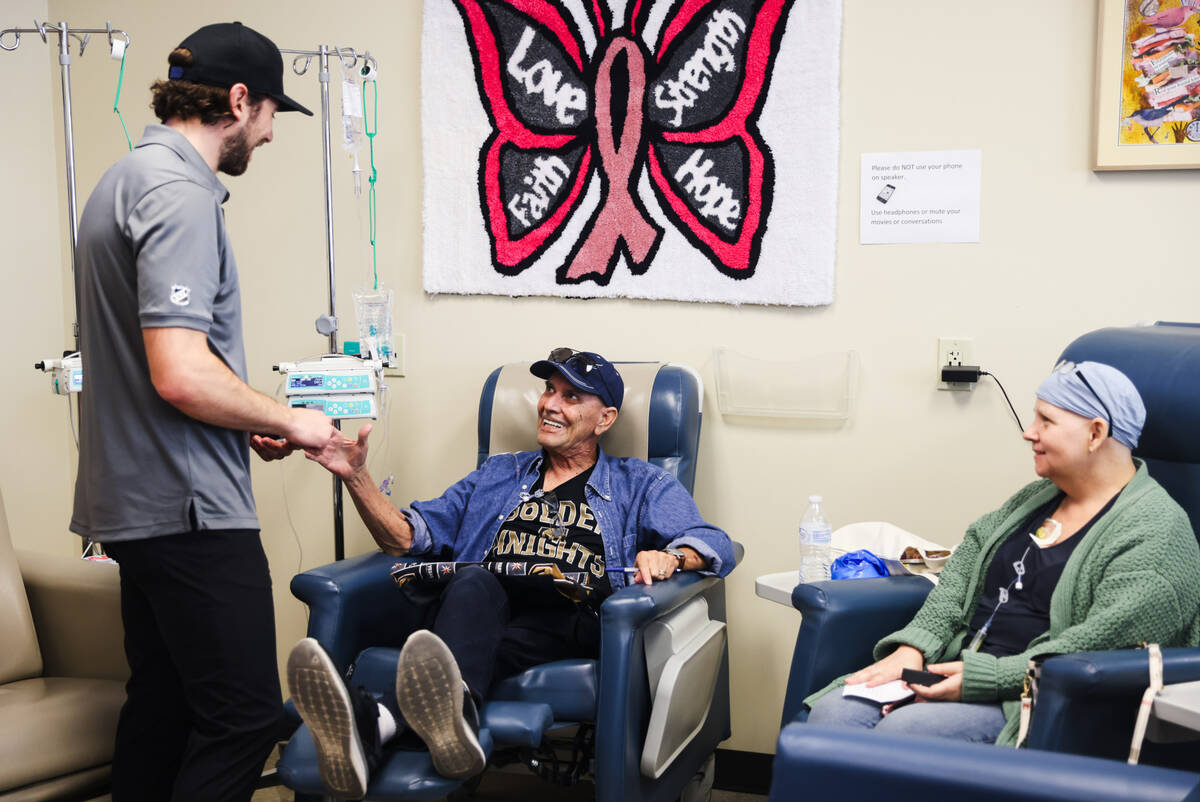 Shea Theodore, defenseman for the Golden Knights, greets patient Roy Beheler at the Comprehensi ...