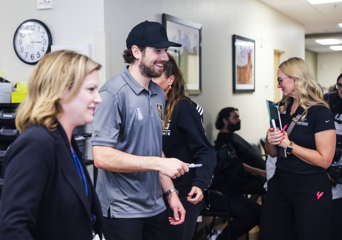 Shea Theodore, defenseman for the Golden Knights, greets patients and staff at the Comprehensiv ...