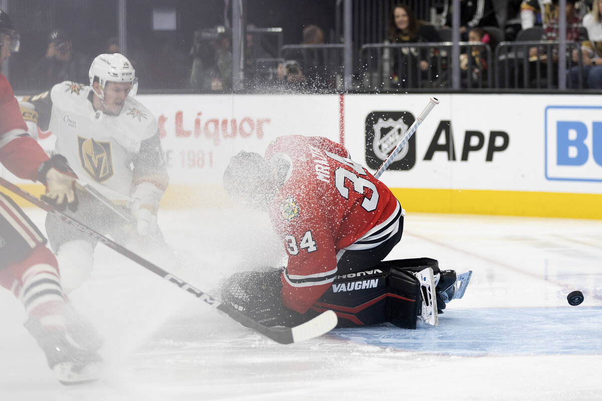 Golden Knights left wing Pavel Dorofeyev (16) scores a goal on Blackhawks goaltender Petr Mraze ...