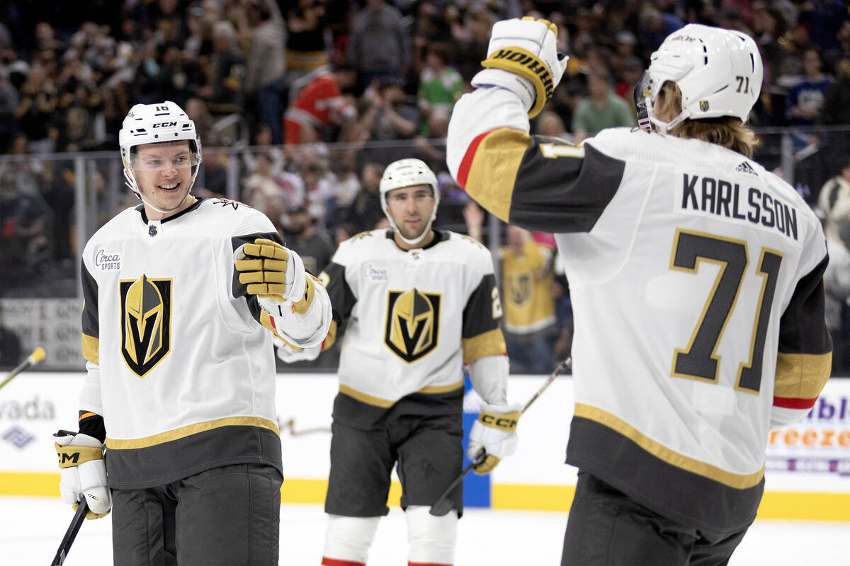 Golden Knights right wing Michael Amadio (22) and center William Karlsson (71) celebrate Karlss ...
