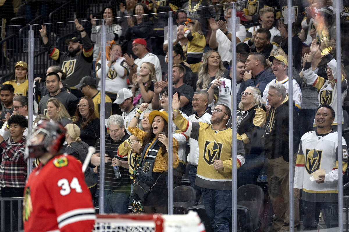 The Golden Knights celebrate center William Karlsson’s goal on Blackhawks goaltender Pet ...