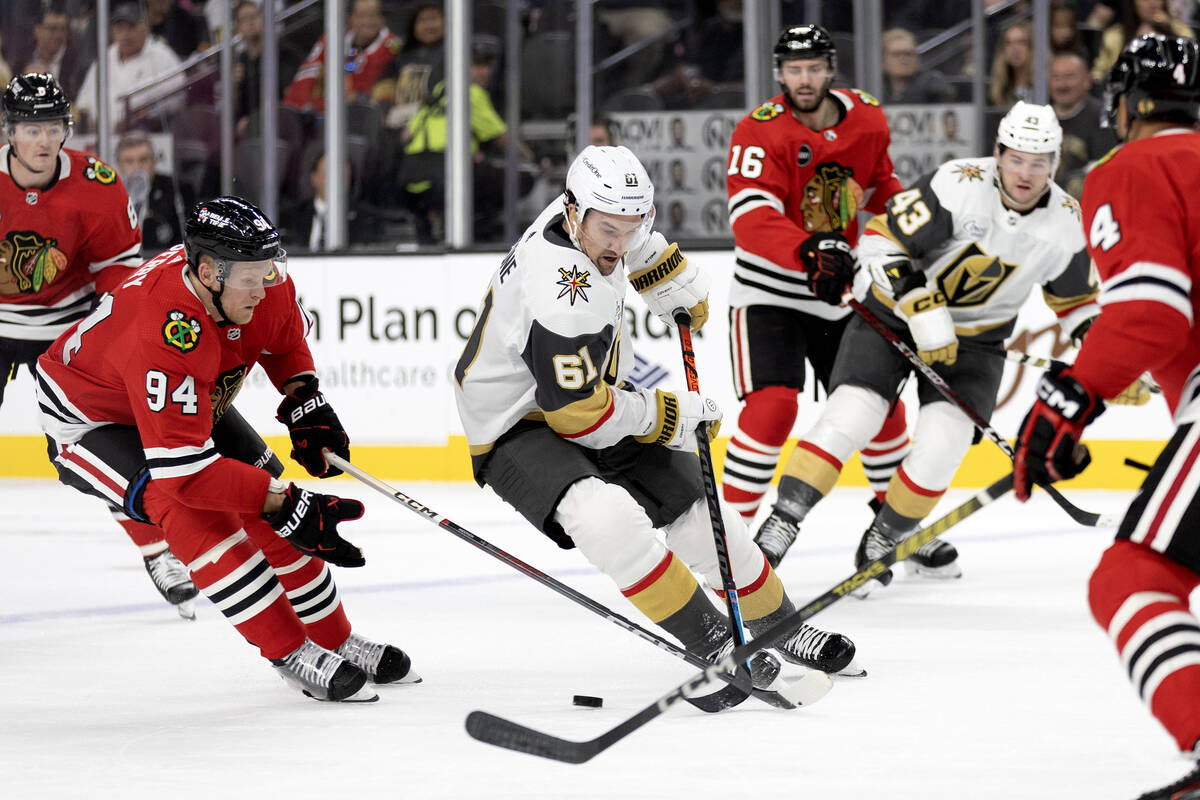 Golden Knights right wing Mark Stone (61) skates with the puck against Blackhawks right wing Co ...
