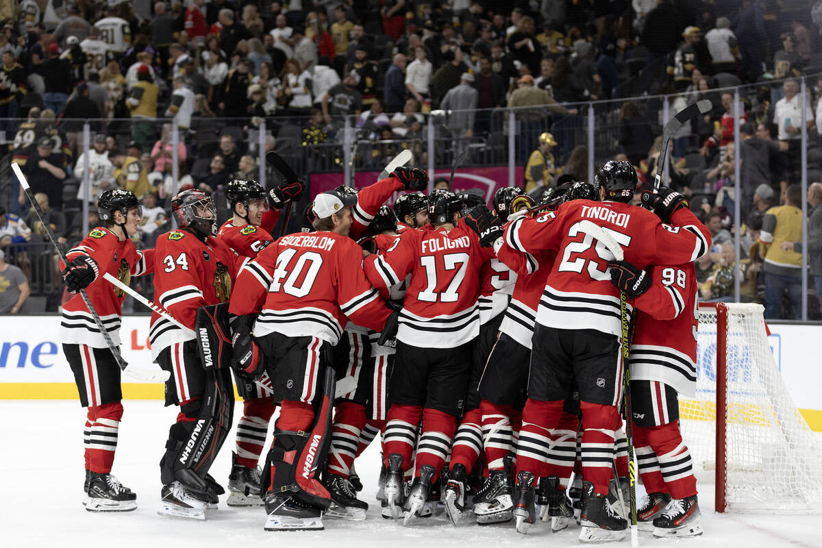 The Blackhawks celebrate their overtime win in an NHL hockey game against the Golden Knights at ...