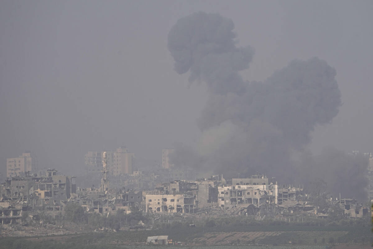 Smoke rises following an Israeli airstrike in the Gaza Strip, as seen from southern Israel, Sat ...
