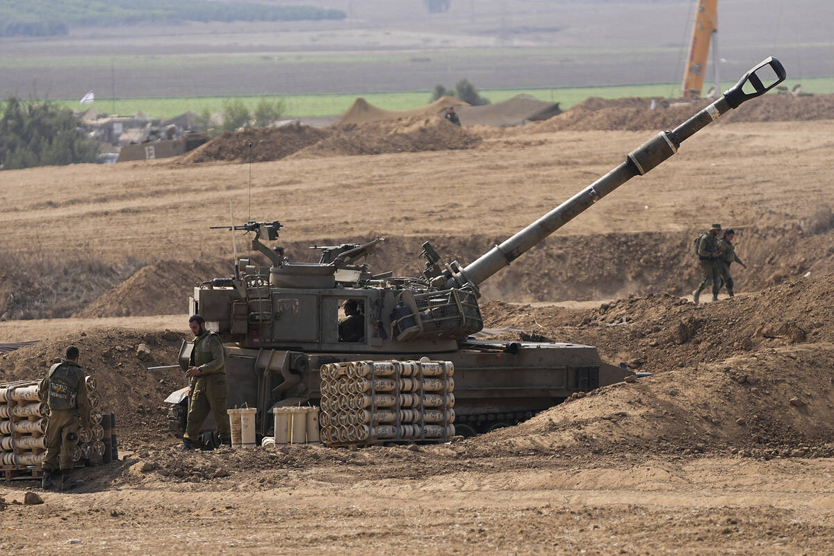 An Israeli mobile artillery unit is seen in a position near the Israel-Gaza border, Israel, Sat ...
