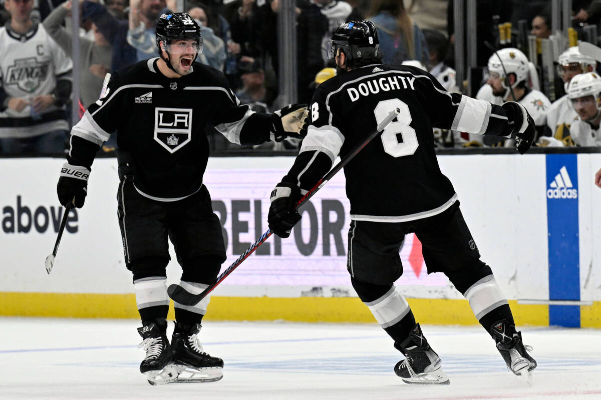 Los Angeles Kings left wing Kevin Fiala, left, celebrates with defenseman Drew Doughty, who sco ...