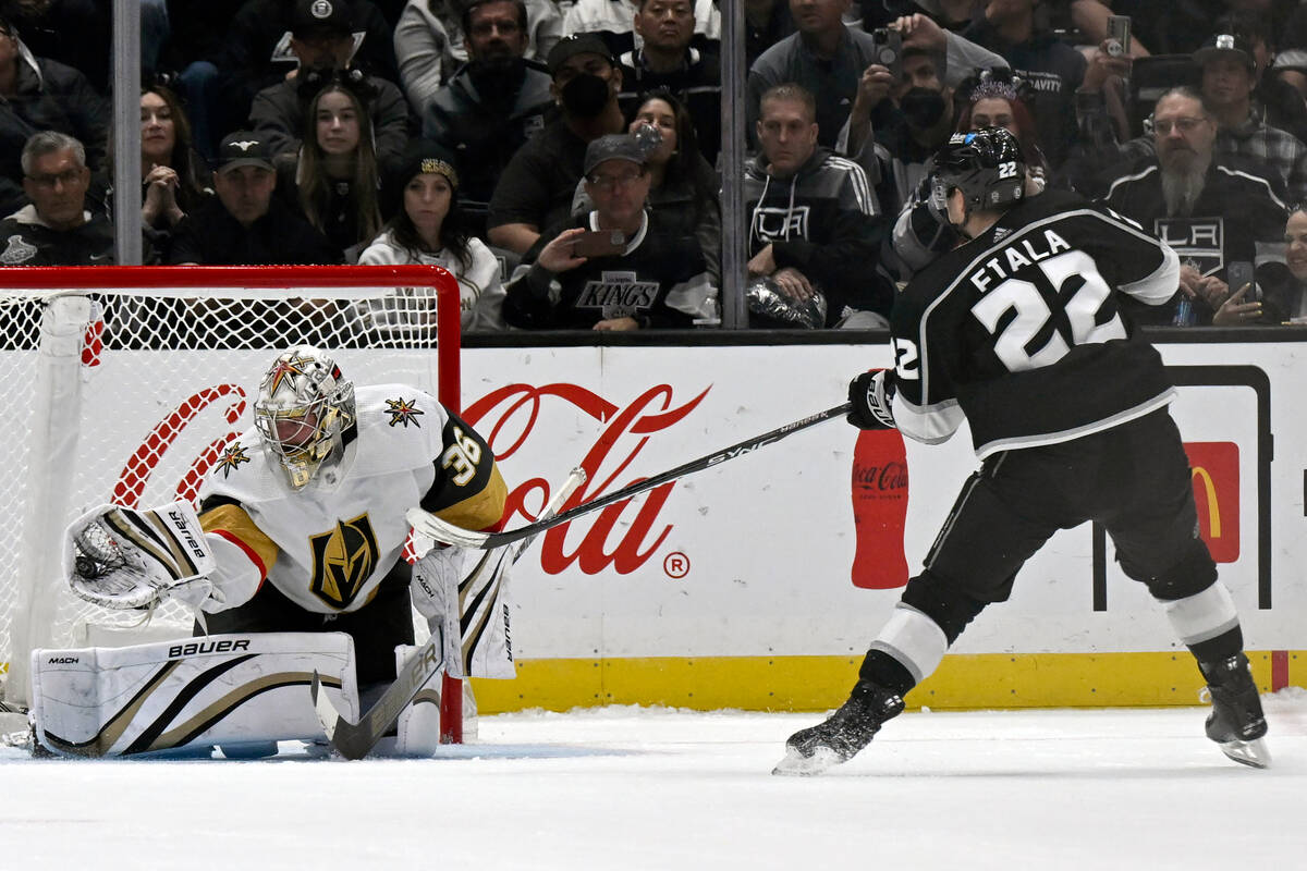 Vegas Golden Knights goaltender Logan Thompson (36) stops Los Angeles Kings left wing Kevin Fia ...