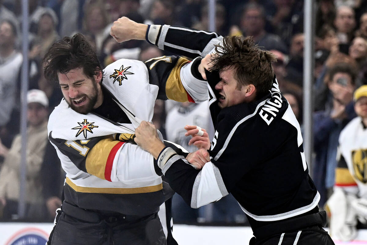 Vegas Golden Knights defenseman Nicolas Hague, left, fights with Los Angeles Kings defenseman A ...