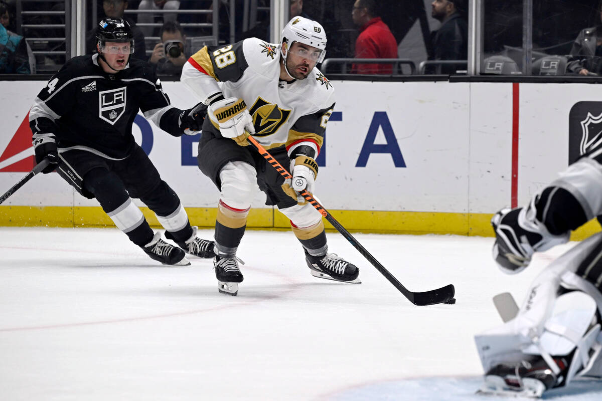 Vegas Golden Knights left wing William Carrier (28) shoots in front of Los Angeles Kings defens ...