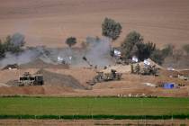 An Israeli mobile artillery unit is seen in a position near the Israel-Gaza border, Israel, Sat ...