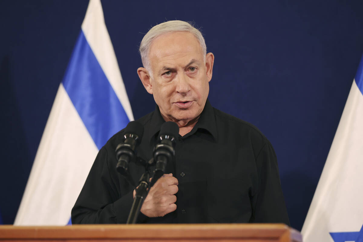 Israeli Prime Minister Benjamin Netanyahu speaks during a press conference with Defense Ministe ...