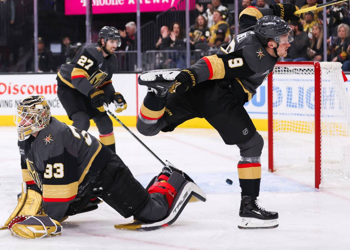 Golden Knights goaltender Adin Hill (33), Golden Knights center Jack Eichel (9), and Golden Kni ...