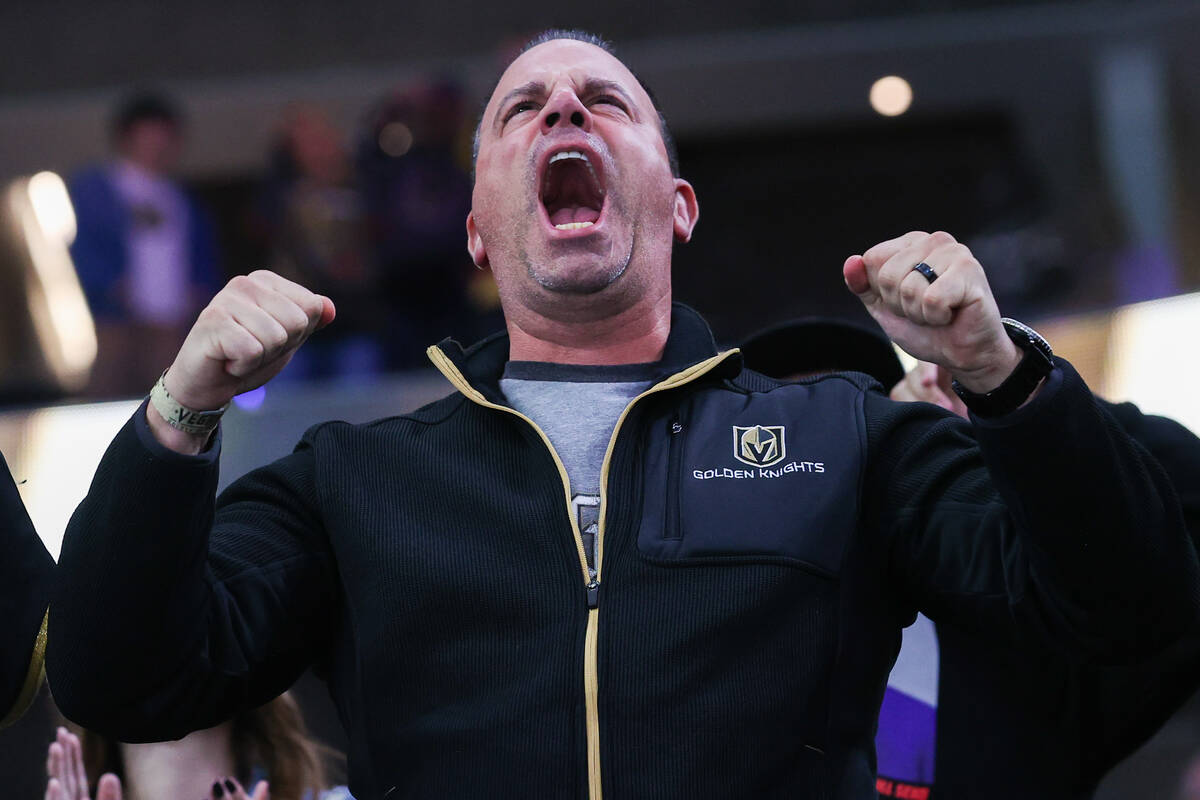 A Golden Knights fan celebrates a goal during an NHL game against the Montreal Canadiens at T-M ...