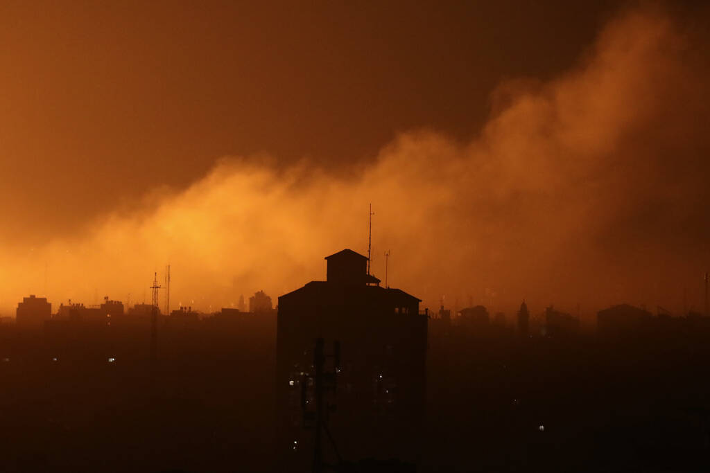 Fire and smoke rise following Israeli airstrikes in the northern Gaza Strip on Monday, Oct. 30, ...