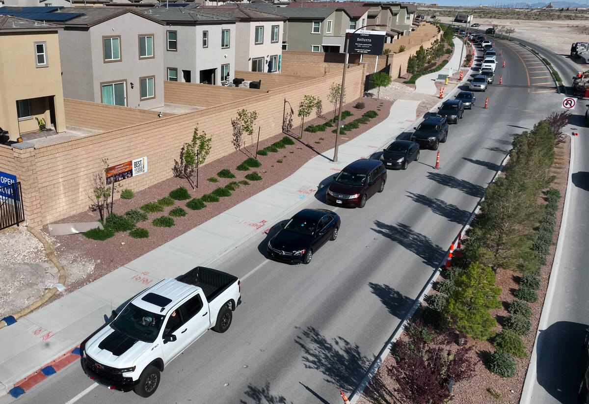 Cars line up to get free gas from Smith’s Marketplace on on Friday, April 14, 2023, in Las V ...