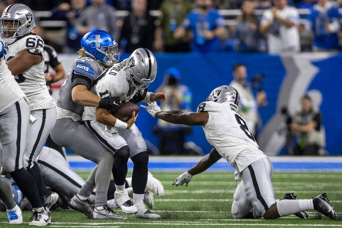 Detroit Lions linebacker Alex Anzalone (34) sacks Raiders quarterback Jimmy Garoppolo (10) with ...