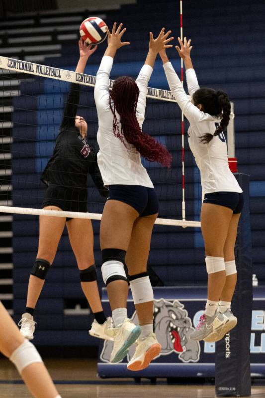 Faith Lutheran outside hitter Bianca Richardson (6) spikes against Centennial middle blocker Al ...